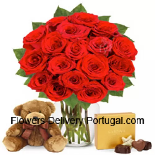 11 Red Roses With Some Ferns In A Glass Vase Accompanied With An Imported Box Of Chocolates And A Cute 12 Inches Tall Brown Teddy Bear