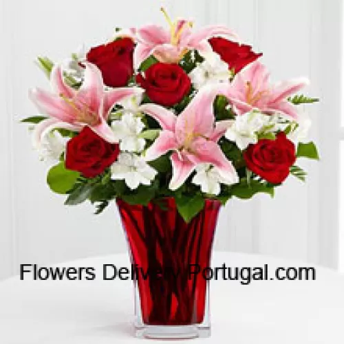6 Red Roses And 5 Pink Lilies With Seasonal Fillers In A Beautiful Glass Vase