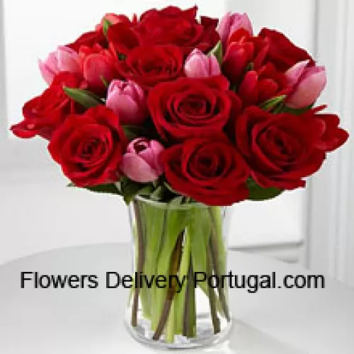 11 Red Roses And 6 Pink Tulips With Some Seasonal Fillers In A Glass Vase